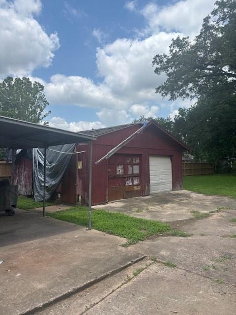 2513 Bostic St, Houston, TX 77093 - view of front of property with concrete driveway, an outdoor structure, and a carport