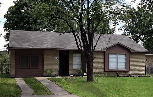5734 Arthington St, Houston, TX 77053 - view of front of house featuring a front lawn, brick siding, and roof with shingles