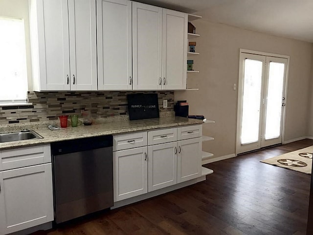 5734 Arthington St, Houston, TX 77053 - kitchen featuring stainless steel dishwasher, open shelves, plenty of natural light, and white cabinets