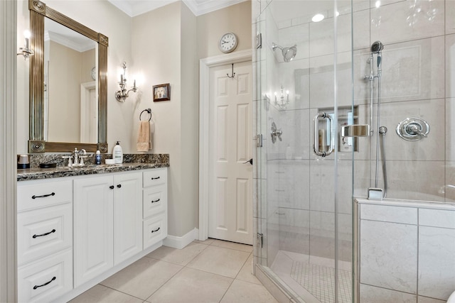 926 Grand Oaks Cir, College Station, TX 77840 - bathroom featuring vanity, ornamental molding, a shower stall, and tile patterned floors