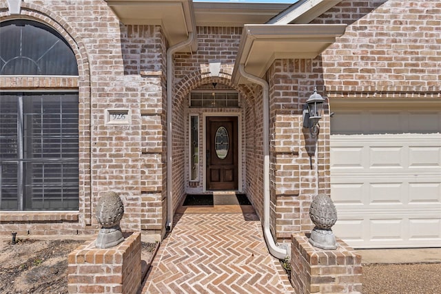 926 Grand Oaks Cir, College Station, TX 77840 - doorway to property with brick siding and an attached garage