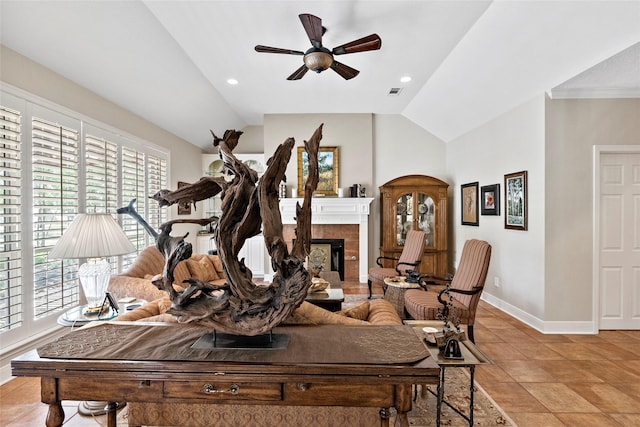 926 Grand Oaks Cir, College Station, TX 77840 - living area featuring vaulted ceiling, baseboards, ceiling fan, a tiled fireplace, and recessed lighting