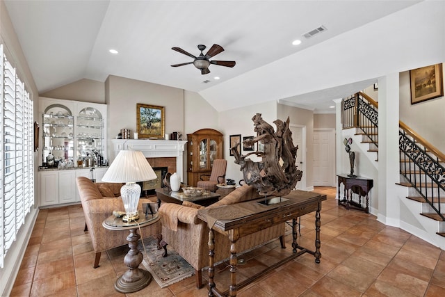 926 Grand Oaks Cir, College Station, TX 77840 - living area featuring vaulted ceiling, a ceiling fan, stairway, a tile fireplace, and recessed lighting