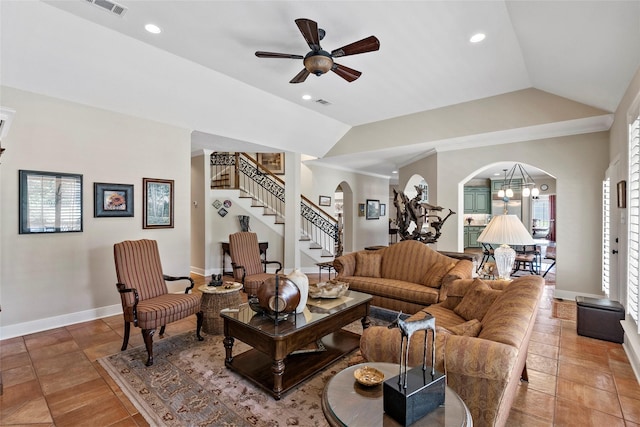 926 Grand Oaks Cir, College Station, TX 77840 - living area featuring arched walkways, stairs, ceiling fan, lofted ceiling, and baseboards