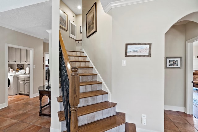 926 Grand Oaks Cir, College Station, TX 77840 - stairway featuring crown molding, washer / clothes dryer, arched walkways, baseboards, and recessed lighting