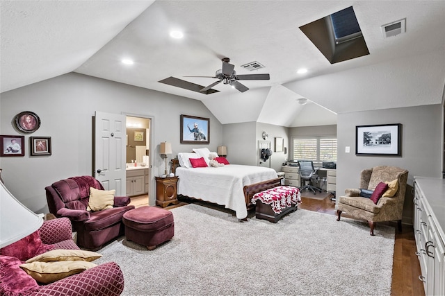 926 Grand Oaks Cir, College Station, TX 77840 - bedroom with vaulted ceiling, wood finished floors, an office area, a skylight, and a ceiling fan