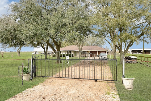 6720 Kacal Rd, Beasley, TX 77417 - view of front of home with a gate, driveway, and an attached garage