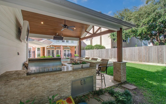 4516 Palmetto St, Bellaire, TX 77401 - view of patio featuring a ceiling fan and a bar