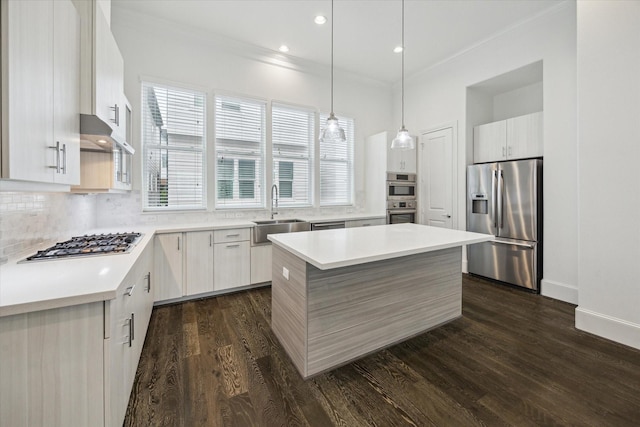 3405 Timbergrove Heights St, Houston, TX 77008 - kitchen featuring stainless steel appliances, a sink, a center island, decorative backsplash, and dark wood-type flooring