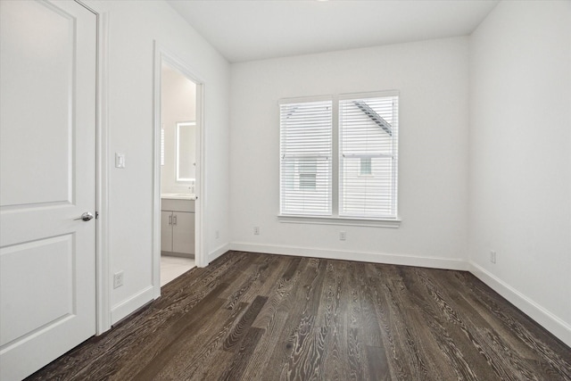 3405 Timbergrove Heights St, Houston, TX 77008 - unfurnished bedroom with dark wood finished floors, baseboards, and ensuite bath
