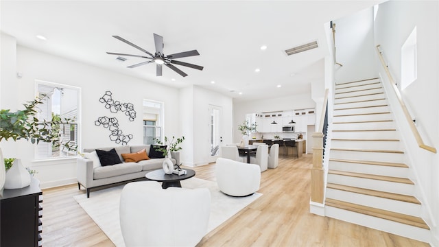 1637 Beall St, Houston, TX 77008 - living area with ceiling fan, stairs, light wood finished floors, and recessed lighting