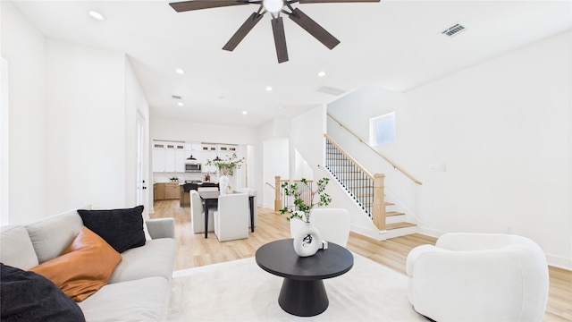1637 Beall St, Houston, TX 77008 - living area with light wood finished floors, stairway, a ceiling fan, and recessed lighting