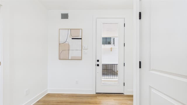 1637 Beall St, Houston, TX 77008 - doorway to outside with light wood-style floors and plenty of natural light