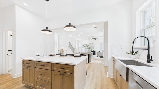 1637 Beall St, Houston, TX 77008 - kitchen featuring light wood-style floors, a ceiling fan, recessed lighting, stainless steel dishwasher, and hanging light fixtures