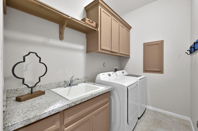 281 Berkley Dr, Montgomery, TX 77356 - laundry area featuring cabinet space, washer and dryer, and light tile patterned floors