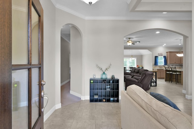 281 Berkley Dr, Montgomery, TX 77356 - living area with arched walkways, ceiling fan, crown molding, light tile patterned floors, and recessed lighting
