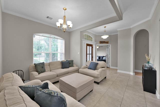 281 Berkley Dr, Montgomery, TX 77356 - living area featuring arched walkways, crown molding, a chandelier, and light tile patterned floors