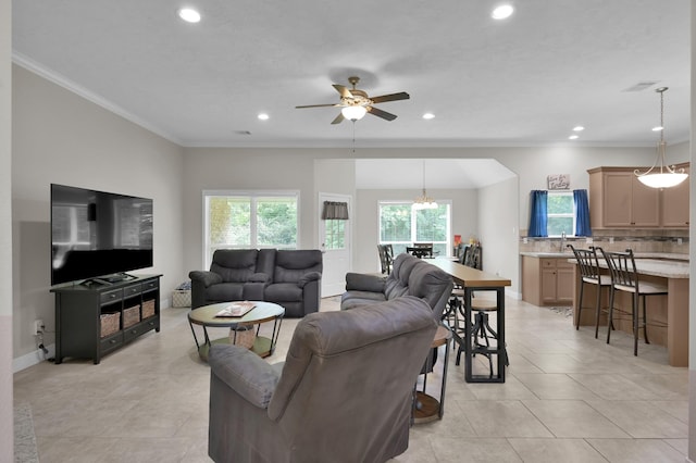 281 Berkley Dr, Montgomery, TX 77356 - living room with ornamental molding, ceiling fan, recessed lighting, light tile patterned flooring, and a chandelier