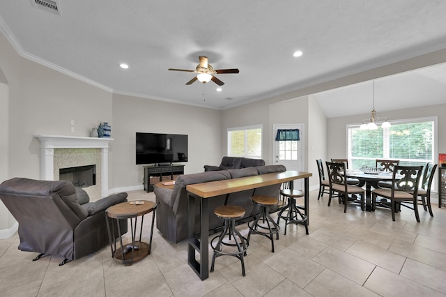 281 Berkley Dr, Montgomery, TX 77356 - living area featuring a ceiling fan, a fireplace, ornamental molding, a chandelier, and recessed lighting