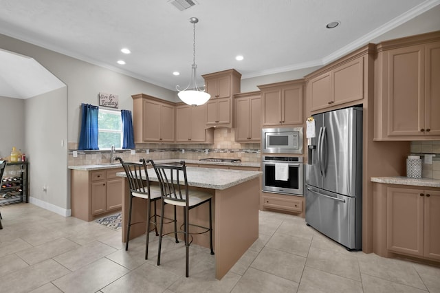 281 Berkley Dr, Montgomery, TX 77356 - kitchen with appliances with stainless steel finishes, tasteful backsplash, a center island, recessed lighting, and a kitchen bar