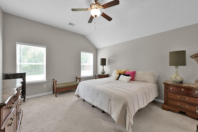 281 Berkley Dr, Montgomery, TX 77356 - bedroom with multiple windows, light colored carpet, lofted ceiling, and a ceiling fan