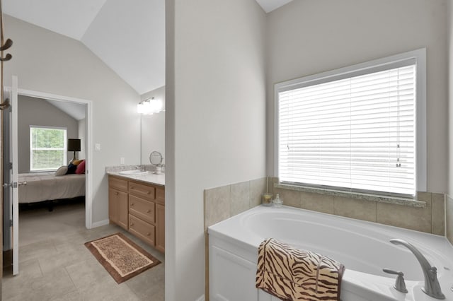 281 Berkley Dr, Montgomery, TX 77356 - ensuite bathroom with vanity, lofted ceiling, and a garden tub