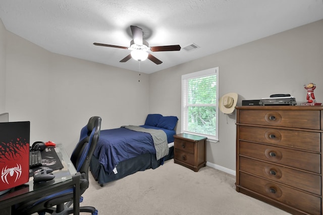 281 Berkley Dr, Montgomery, TX 77356 - bedroom featuring light carpet, a desk, and a ceiling fan