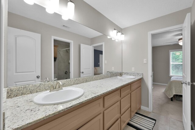 281 Berkley Dr, Montgomery, TX 77356 - full bath featuring double vanity, a shower, ensuite bathroom, ceiling fan, and tile patterned floors