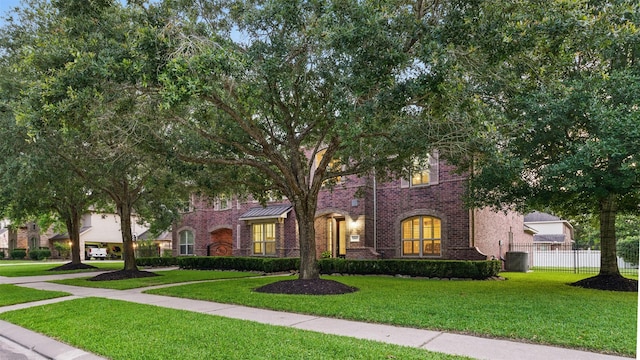 3602 Lindhaven Dr, Pearland, TX 77584 - view of front of house featuring cooling unit and brick siding