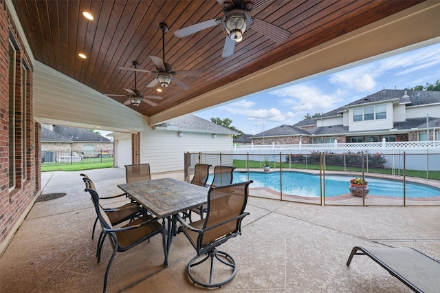 3602 Lindhaven Dr, Pearland, TX 77584 - fenced backyard featuring a patio, ceiling fan, and outdoor dining area