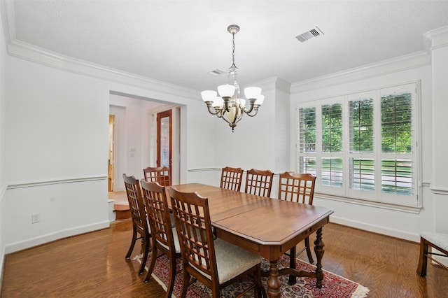3602 Lindhaven Dr, Pearland, TX 77584 - dining room with ornamental molding, a chandelier, wood finished floors, and baseboards