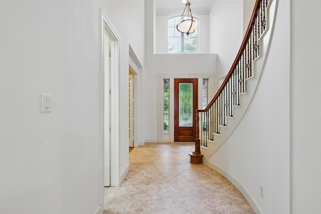 3602 Lindhaven Dr, Pearland, TX 77584 - entrance foyer featuring plenty of natural light, stairs, baseboards, and a high ceiling