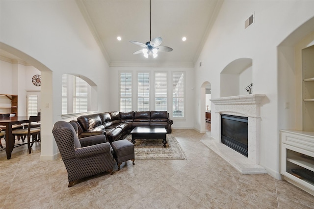 3602 Lindhaven Dr, Pearland, TX 77584 - living area featuring a ceiling fan, high vaulted ceiling, a fireplace, crown molding, and healthy amount of natural light