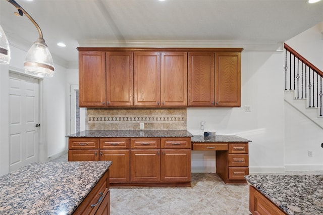 3602 Lindhaven Dr, Pearland, TX 77584 - kitchen featuring brown cabinetry, backsplash, dark stone countertops, ornamental molding, and recessed lighting