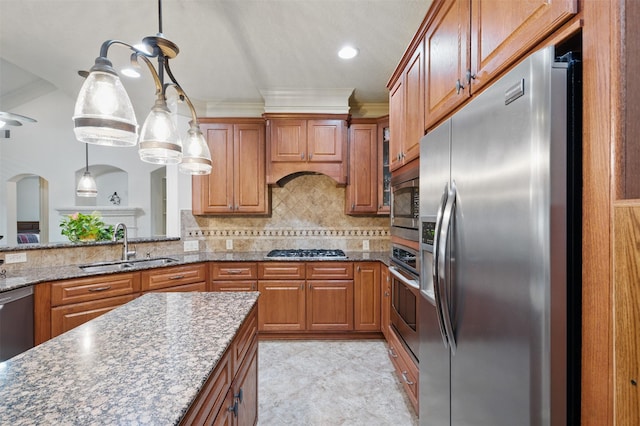 3602 Lindhaven Dr, Pearland, TX 77584 - kitchen with appliances with stainless steel finishes, a sink, brown cabinets, crown molding, and recessed lighting