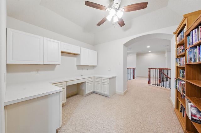 3602 Lindhaven Dr, Pearland, TX 77584 - kitchen featuring light carpet, arched walkways, white cabinets, ceiling fan, and light countertops