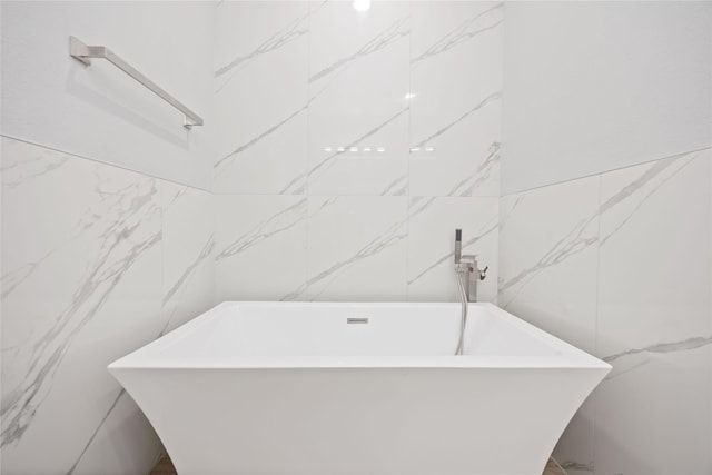 4923 Golden Forest Dr, Houston, TX 77091 - full bath featuring tile walls and a freestanding bath