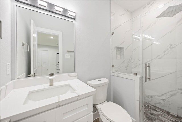 4923 Golden Forest Dr, Houston, TX 77091 - full bathroom with vanity, toilet, and a marble finish shower