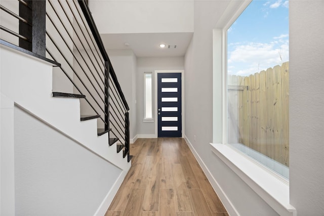 4923 Golden Forest Dr, Houston, TX 77091 - entrance foyer featuring wood finished floors, stairs, baseboards, and recessed lighting