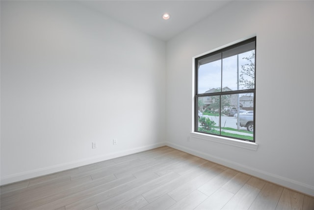 833 Laguna Green Ln, Katy, TX 77493 - spare room featuring baseboards, light wood-type flooring, and recessed lighting