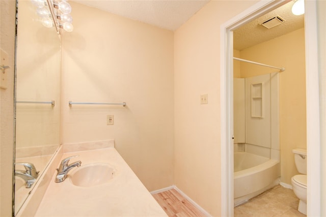 6103 Ludington Dr Unit 4-941, Houston, TX 77035 - bathroom with toilet, vanity, a textured ceiling, shower / bath combination, and baseboards