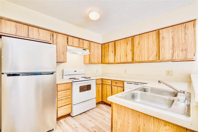 6103 Ludington Dr Unit 4-941, Houston, TX 77035 - kitchen with white appliances, under cabinet range hood, light wood finished floors, a textured ceiling, and light countertops
