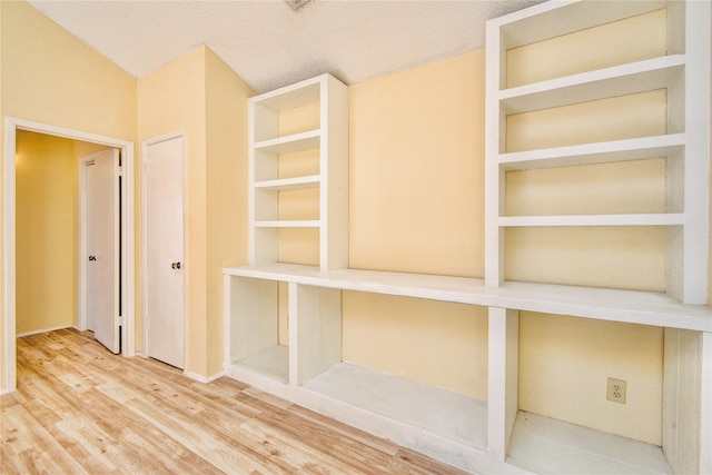6103 Ludington Dr Unit 4-941, Houston, TX 77035 - hall with wood finished floors, baseboards, and built in features