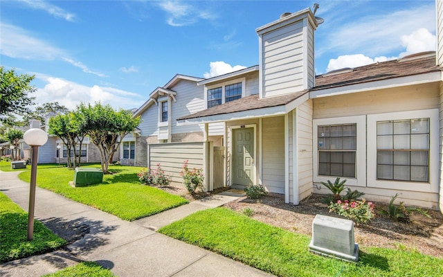 6103 Ludington Dr Unit 4-941, Houston, TX 77035 - multi unit property featuring a chimney, a front lawn, and roof with shingles