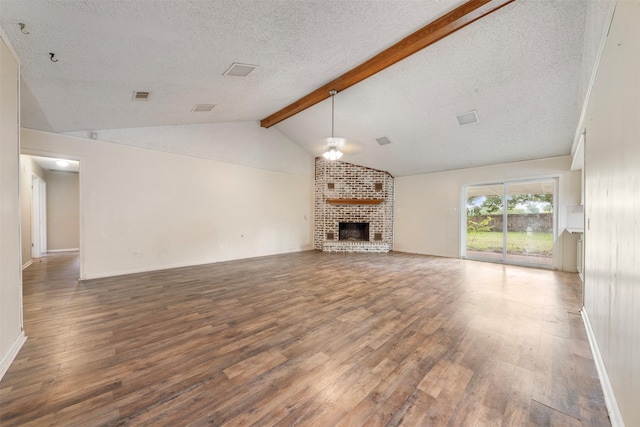 31302 Wisteria Rd, Magnolia, TX 77355 - unfurnished living room with a textured ceiling, wood finished floors, a fireplace, and ceiling fan