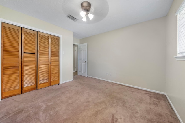 31302 Wisteria Rd, Magnolia, TX 77355 - unfurnished bedroom featuring carpet, a closet, and a ceiling fan