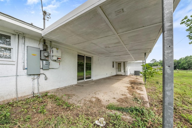 31302 Wisteria Rd, Magnolia, TX 77355 - back of house featuring a patio area and an attached carport