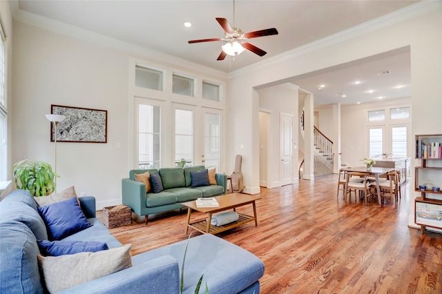 1348 W 25th St, Houston, TX 77008 - living room with stairway, ornamental molding, a ceiling fan, light wood-type flooring, and recessed lighting
