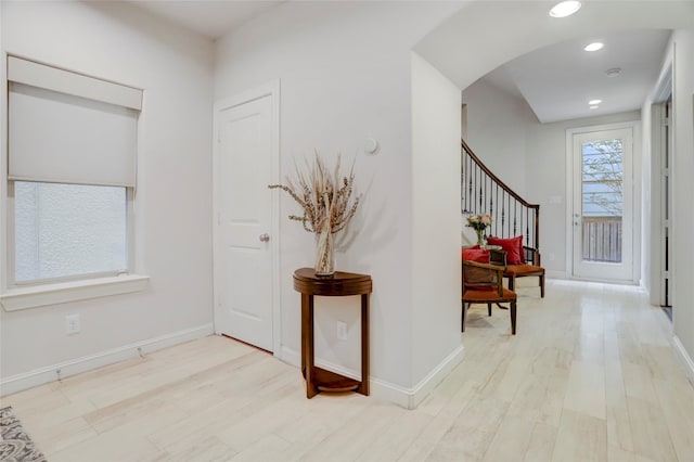 1348 W 25th St, Houston, TX 77008 - foyer entrance featuring wood finished floors, stairway, arched walkways, recessed lighting, and baseboards