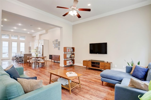 1348 W 25th St, Houston, TX 77008 - living room with crown molding, a ceiling fan, light wood-style floors, baseboards, and recessed lighting